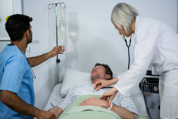 istock Doctor examining a patient with a stethoscope while checking glucose bottle 648953460