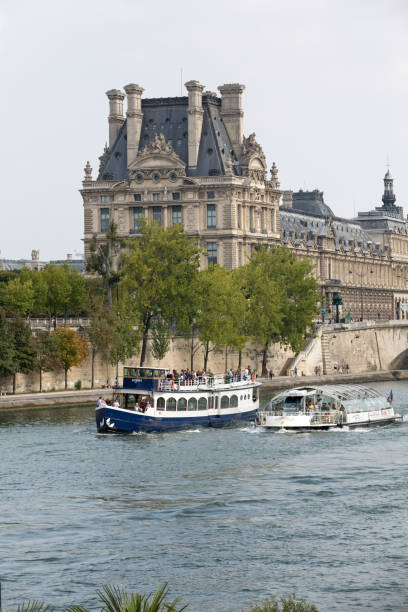 Paris -  Seine between Louvre and the Museum D'Orsay Paris, France - September 7, 2014: Paris -  Seine between Louvre and the Museum D'Orsay musee dorsay stock pictures, royalty-free photos & images