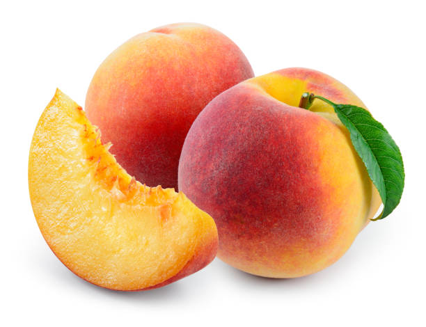 istock Peach with slice and leaf isolated on white. With clipping path. 648954578