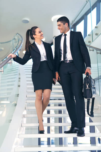 istock Business colleagues talking on stairs 648957590