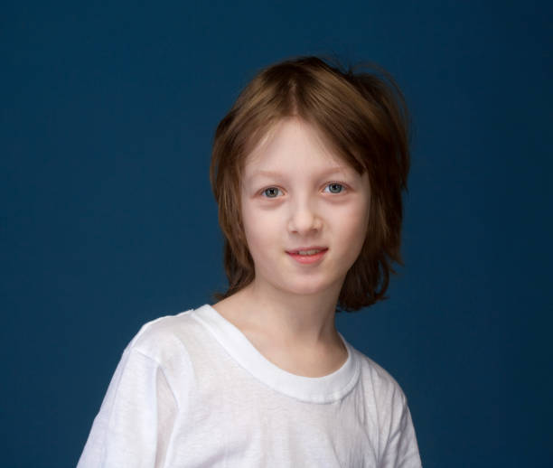 istock Portrait of a Boy with Blond Hair Looking 648963748