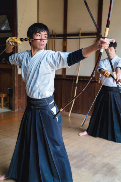 Japanese archer draws his bow ready to fire