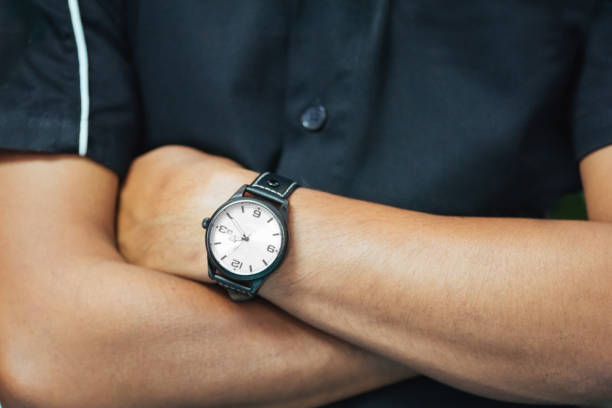 istock Close up Engineer wearing watch and cross one's arm 648967870