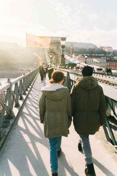 istock Woman and man walking in Budapest old town 648971108