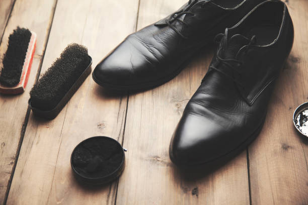 istock Shoe care accessories on a wooden table 648975548