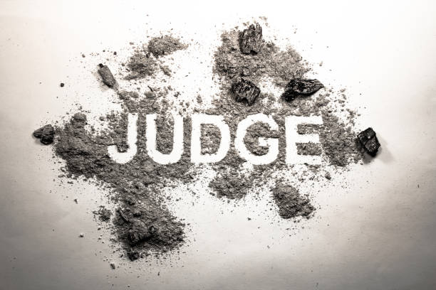 istock Word judge written in dirt, filth, ash 648978772