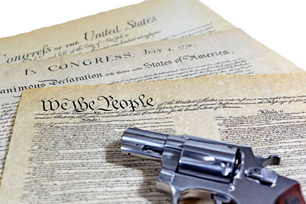 US Constitution Historical Documents with Pistol US Constitution with Bill of Rights and Declaration of Independence with a revolver gun control photos stock pictures, royalty-free photos & images