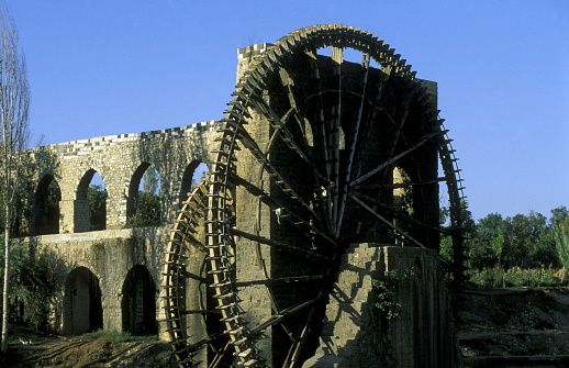 a traditional norias wooden water wheelsl in the city of Hama in Syria in the middle east