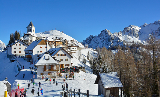 Scenic aerial view of Dolomites covered in snow in winter