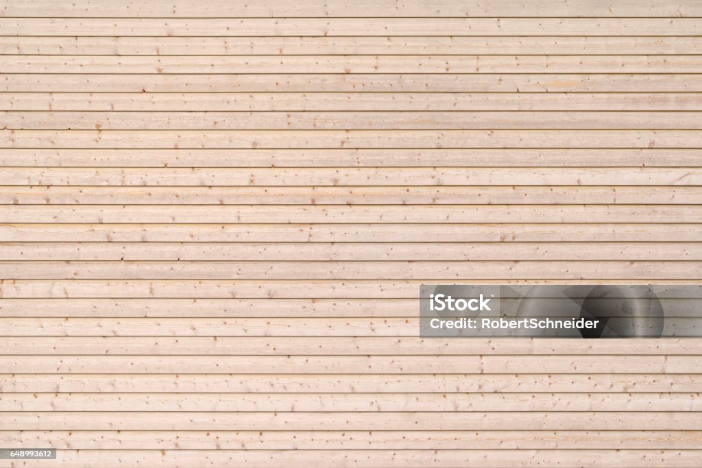 Untreated board wall Wooden wall made of untreated, horizontal, screwed boards of spruce wood Wood - Material Stock Photo