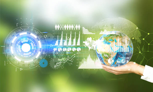 istock Close up of woman’s hand with a globe, green 649008032