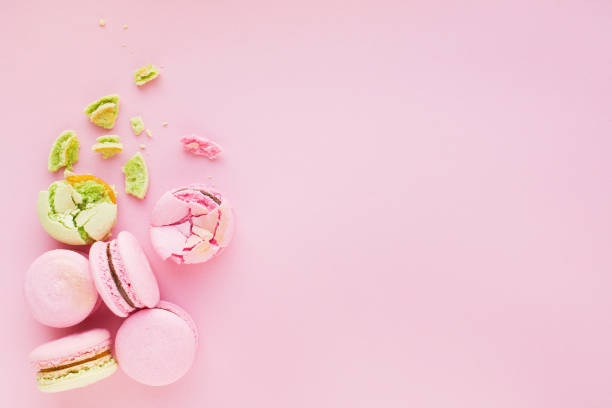 istock Group of tasty macarons on pink background 649008998