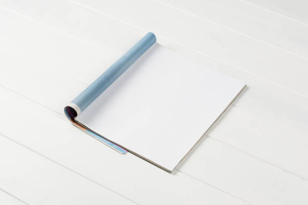 istock Mock-up magazines or catalog on wooden table background. 649009096