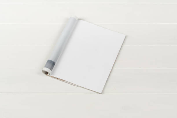 istock Mock-up magazines or catalog on white wooden table background. 649009542