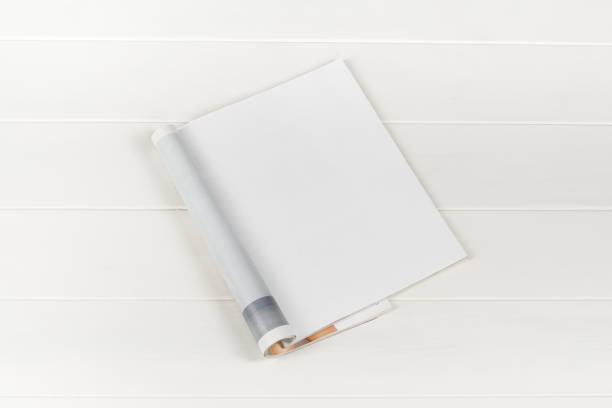 istock Mock-up magazines or catalog on white wooden table background. 649009628