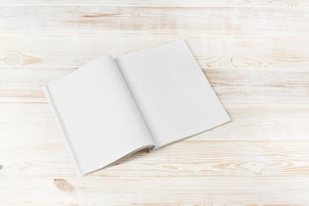 istock Mock-up magazines or catalog on white wooden table background. 649009744
