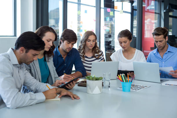 istock Team of graphic designers working together 649011988