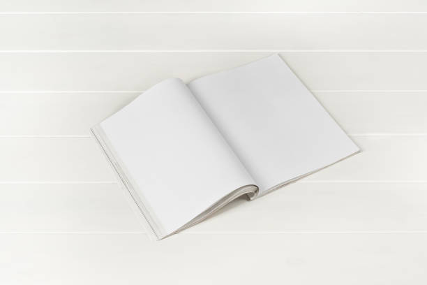 istock Mock-up magazines or catalog on white wooden table background. 649012048