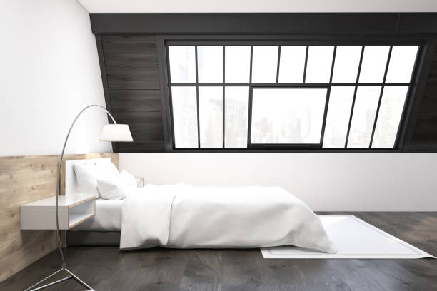 istock Side view of an attic bedroom with a carpet 649012164