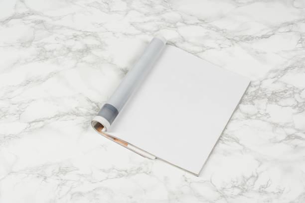 istock Mock-up magazines or catalog on white marble table background. 649012714