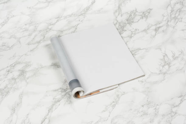 istock Mock-up magazines or catalog on white marble table background. 649012752