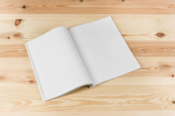 istock Mock-up magazines or catalog on natural wooden table background. 649015246