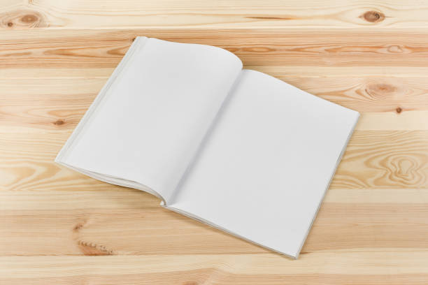 istock Mock-up magazines or catalog on natural wooden table background. 649015342