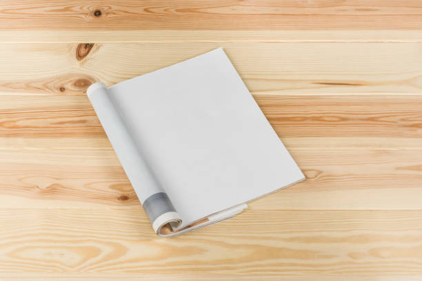 istock Mock-up magazines or catalog on natural wooden table background. 649015494