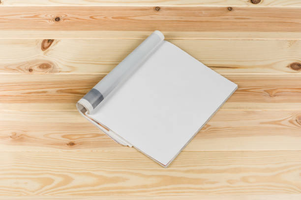 istock Mock-up magazines or catalog on natural wooden table background. 649015540