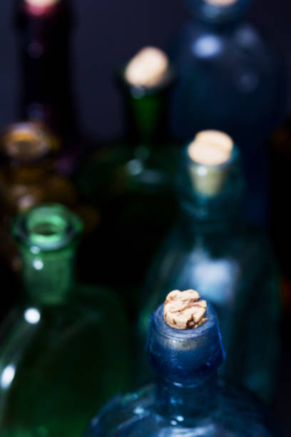 istock Old colourful bottles against a dark background 649016468