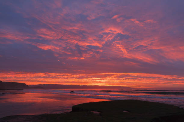 istock Sunrise at the beach with waves 649022592