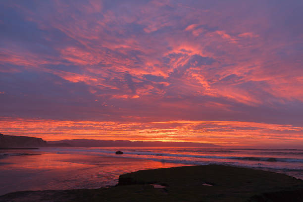 istock Sunrise at the beach with waves 649022642