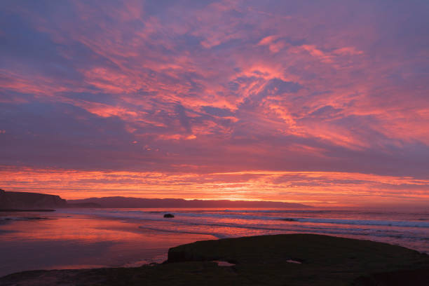 istock Sunrise at the beach with waves 649022670