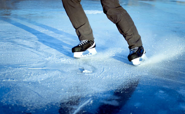 istock The guy rides on skates on ice in the winter. 649025486