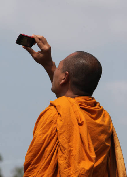 monks at the Bun Bang Fai Festival or Rocket Festival in the City of Yasothon in the Region of Isan in Northeast Thailand in Thailand.\