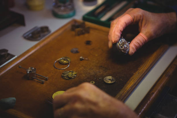 istock Horologist repairing a watch 649064294