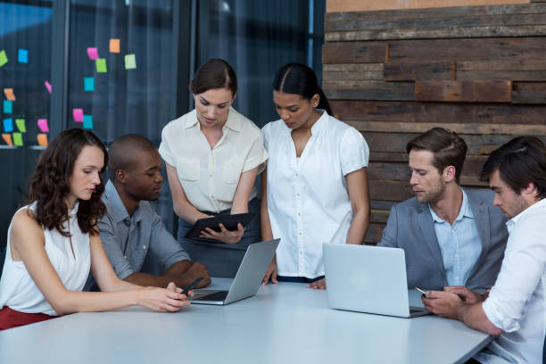istock Business executives discussing during meeting 649064536