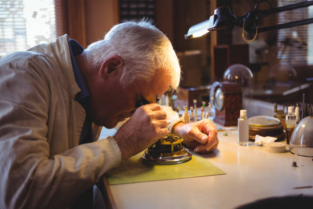 istock Horologist repairing a watch 649067162