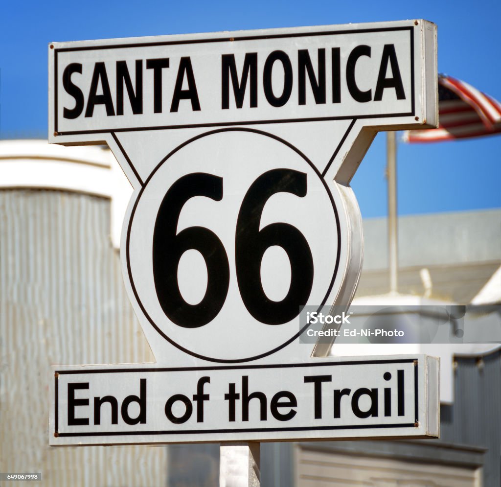 Road sign indicating the end of US Route 66 at Santa Monica, California A road sign at Santa Monica, California, indicates the end of iconic US Route 66 Driving Stock Photo