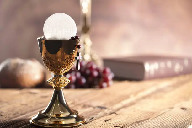 Catholic theme. Chalice, altar cross, bread and grapes.