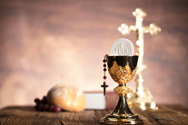 Religion. Christianity theme. Catholic theme. Chalice, altar cross, bread and grapes. liturgy photos stock pictures, royalty-free photos & images