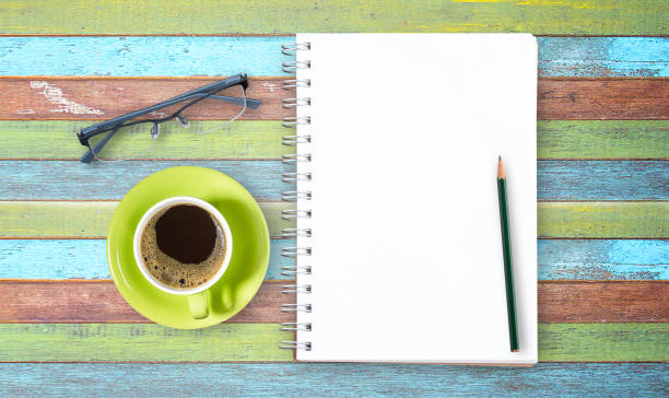 istock Blank notepad and pencil with on wooden 649075300