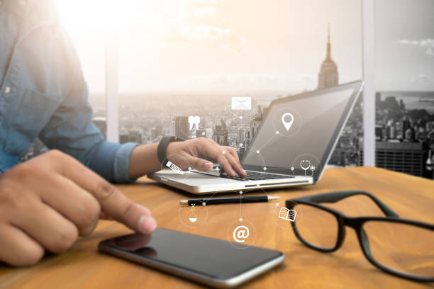 istock man hand holding smartphone device and  technology , businessman working with modern devices, digital tablet computer and mobile phone. 649077868