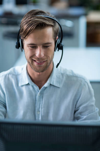 istock Business executive with headsets in office 649078666