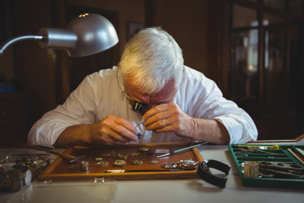 istock Horologist repairing a watch 649082114