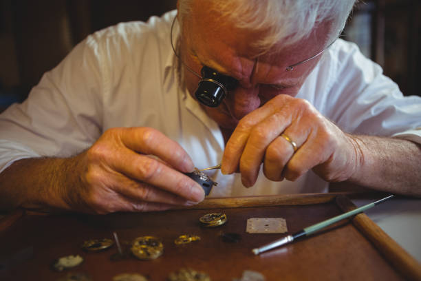 istock Horologist repairing a watch 649082158