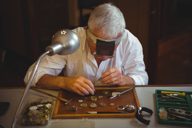 istock Horologist repairing a watch 649082214