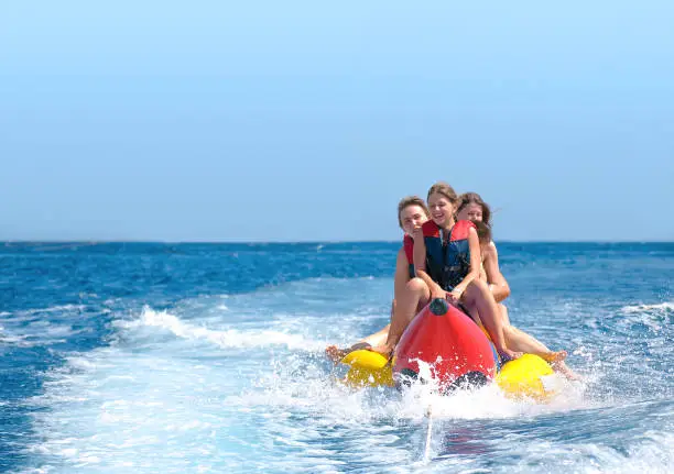 Photo of People ride on banana boat