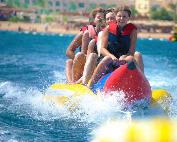 istock People ride on banana boat 649082270