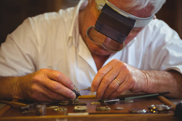 istock Horologist repairing a watch 649082278